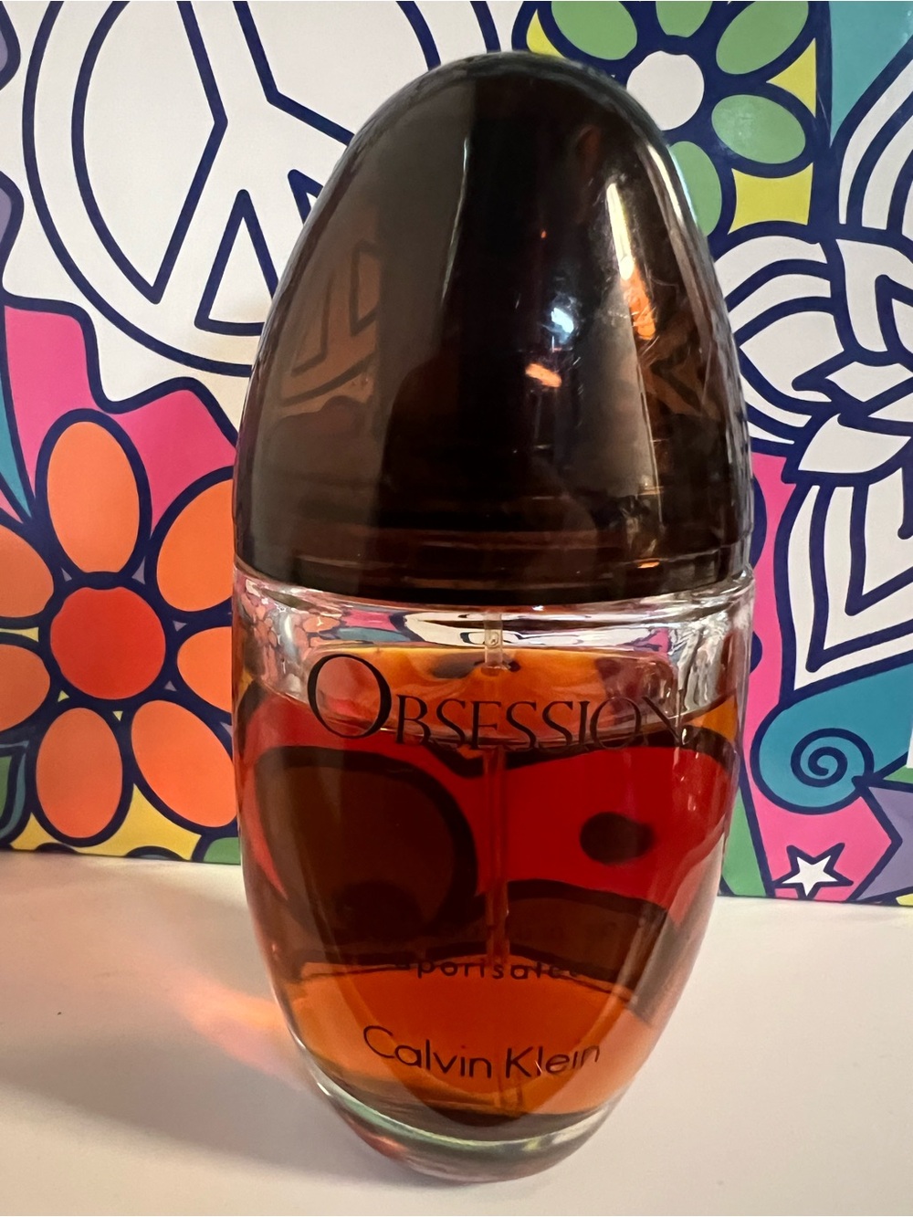 Calvin Klein Obsession Glass Bottle with Amber and Red Tones